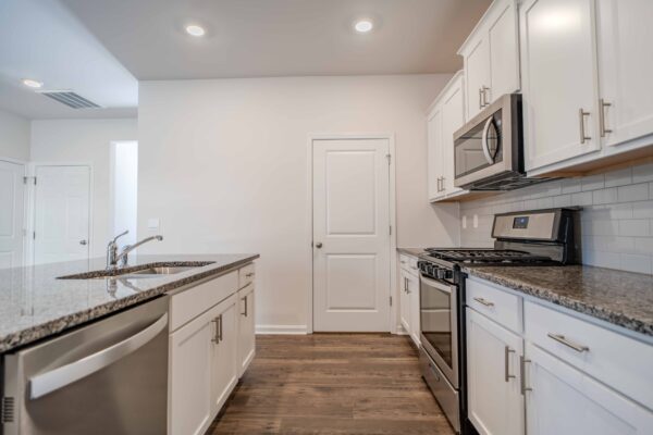 Gourmet kitchen in Greenville, SC, featuring stainless steel appliances and granite countertops