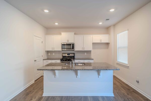 Gourmet kitchen in Greenville, SC, featuring stainless steel appliances and granite countertops