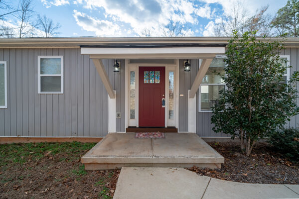 Exterior view of a modern house in Greenville, SC, with a landscaped front yard