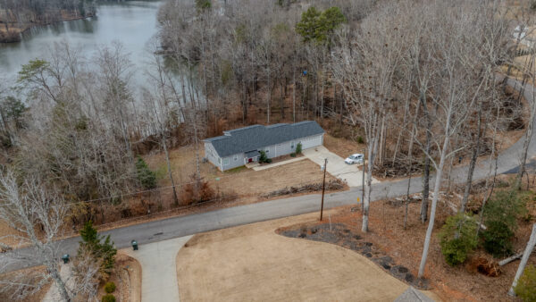 Exterior view of a modern house in Travelers Rest, SC, with a landscaped front yard